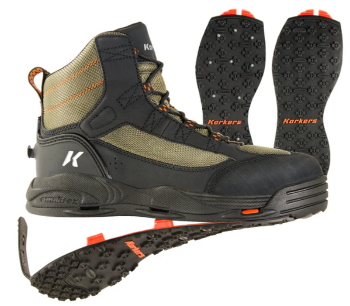 Korkers Greenback OmniTrax Wading Boot in green and black with orange accents, featuring durable mesh and rubber upper, high-traction removable soles, and secure ankle support for fishing.