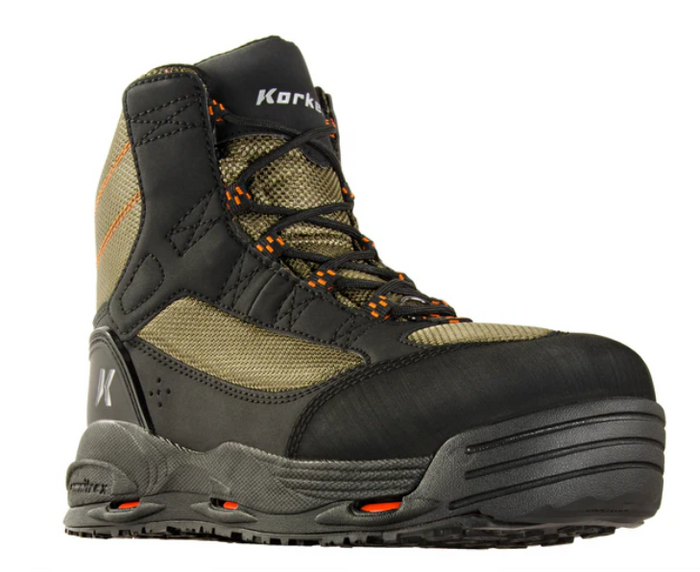 Korkers Greenback OmniTrax Wading Boot in olive and black with durable lacing, reinforced toe, breathable mesh panels, and a sturdy sole designed for fishing tackle and outdoor water activities.