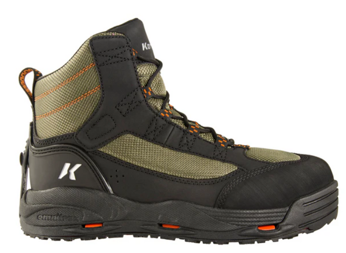 Korkers Greenback OmniTrax Wading Boot in olive green and black with durable rubber sole, reinforced toe, lace-up design, and cushioned ankle support for fishing and outdoor use.