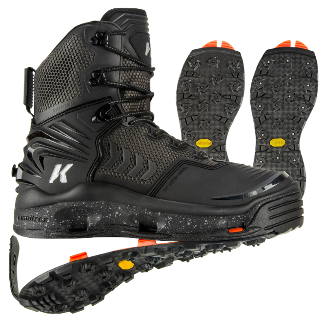 Korkers River Ops Vibarm Wading Boot in black with reinforced ankle support, textured grip sole with metal studs for traction, and durable waterproof construction ideal for fly fishing and outdoor water activities.