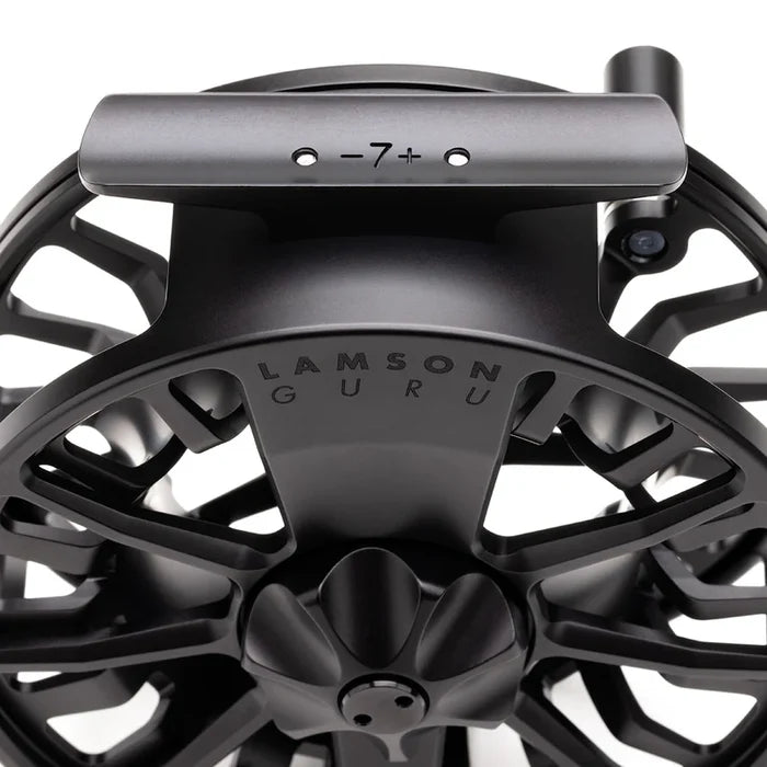 Close-up of a black Lamson Guru S HD Fly Reel highlighting its durable metal construction and detailed design, ideal for precision fishing tackle use.