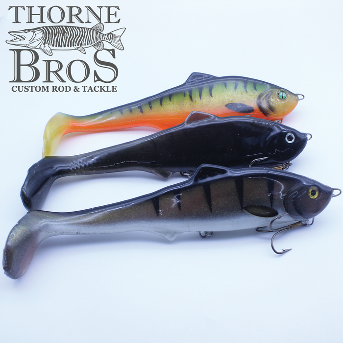 Three lifelike fishing lures in green, black, and brown colors shaped like small fish, displayed with Thorne Bros logo, designed for musky fishing, labeled Llungen $ Maker.