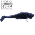 Black soft plastic fishing lure shaped like a small fish with a curled tail and a treble hook underneath, designed for musky fishing, labeled Llungen $ Maker.