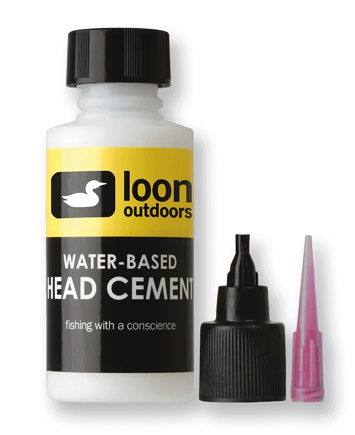 Bottle of Loon Water Based Head Cement System with yellow and black label, alongside a black screw-on cap with applicator tip and a separate pink precision nozzle, used for fishing tackle maintenance.