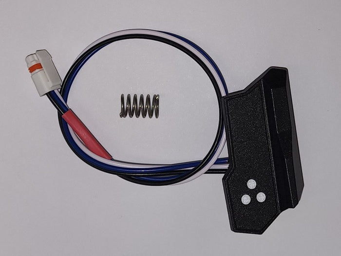Lowrance Ghost Button, Rear Right Kit 000-15313-001 showing a black rectangular button unit with three white dots, attached wires, a white connector, and a small metal spring accessory.