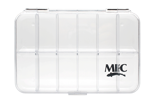 Clear transparent plastic fishing tackle box with multiple compartments and black MFC logo, designed for organizing fishing lures and gear, labeled MFC Clearwater Fly Box.