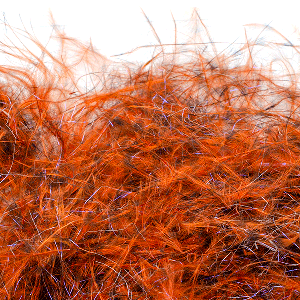 Close-up of MFC Senyo's Dirty Bird Dubbing in vibrant rusty orange with fine, soft fibers used for fly fishing lure tying and fishing tackle.