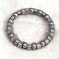 Minn Kota BEARING BALL-STEEL [B066 P/N: 2266000 is a small circular steel bearing ball assembly with evenly spaced ball bearings held by a metallic ring, designed for smooth mechanical movement.