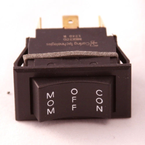 Close-up of a black rocker switch with white lettering displaying "MOM," "OFF," and "CON" positions, identified as Minn Kota SWITCH-MOM/OFF/COM [C016 P/N:2254031, suitable for fishing tackle and marine electronics.