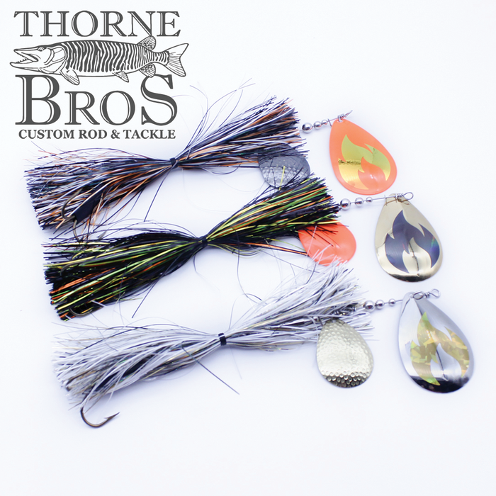 Three detailed Musky Addicts Barn Burner 10/8C fishing lures in black, green, and white with metallic spinner blades displayed on a white background, featuring Thorne Bros custom rod and tackle branding.