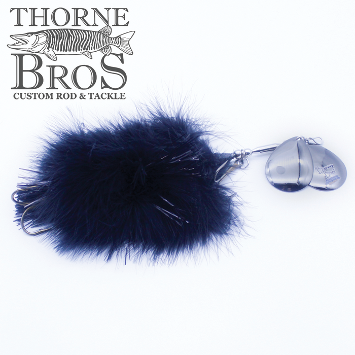 Musky Mayhem Bunny Boo fishing lure with dense black fur and shiny metal blades designed for musky fishing, displayed with Thorne Bros branding for custom fishing tackle.