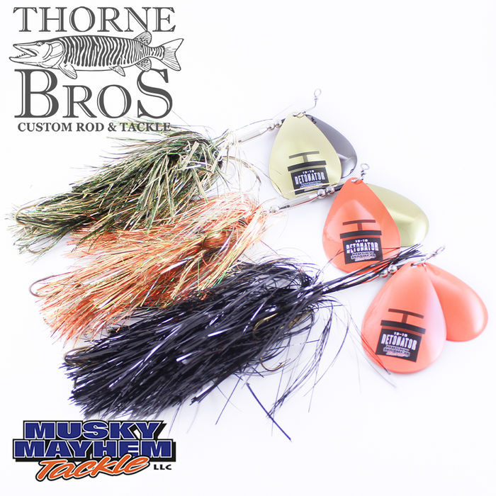 Three detailed fishing lures with metallic spinner blades and multi-colored skirts, labeled Musky Mayhem Detonator 13/10, displayed on a white background with Thorne Bros and Musky Mayhem Tackle logos.