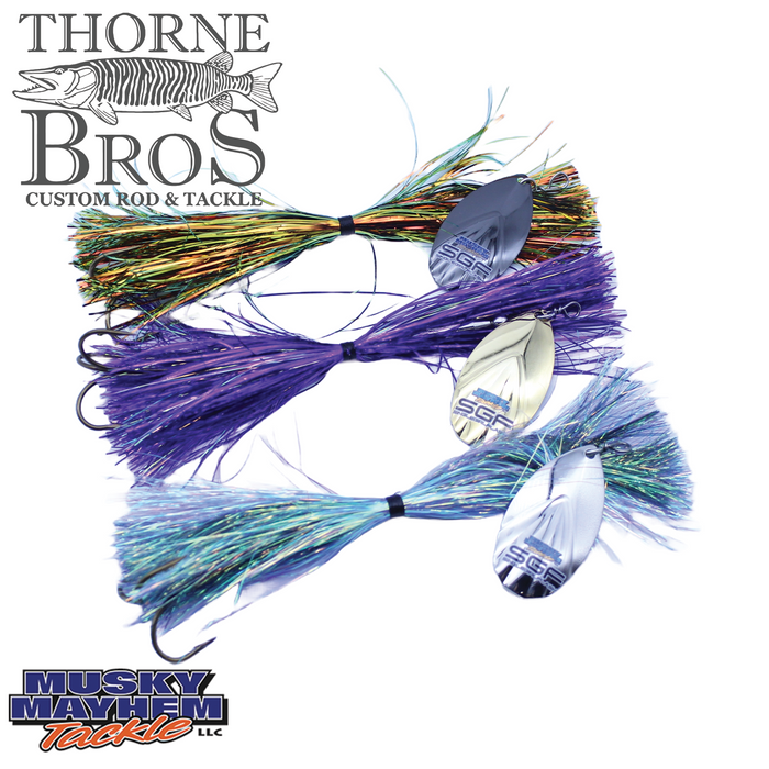 Musky Mayhem Single Girl Flash fishing lures in vibrant orange, purple, and blue colors with reflective silver spinning blades designed for musky fishing.