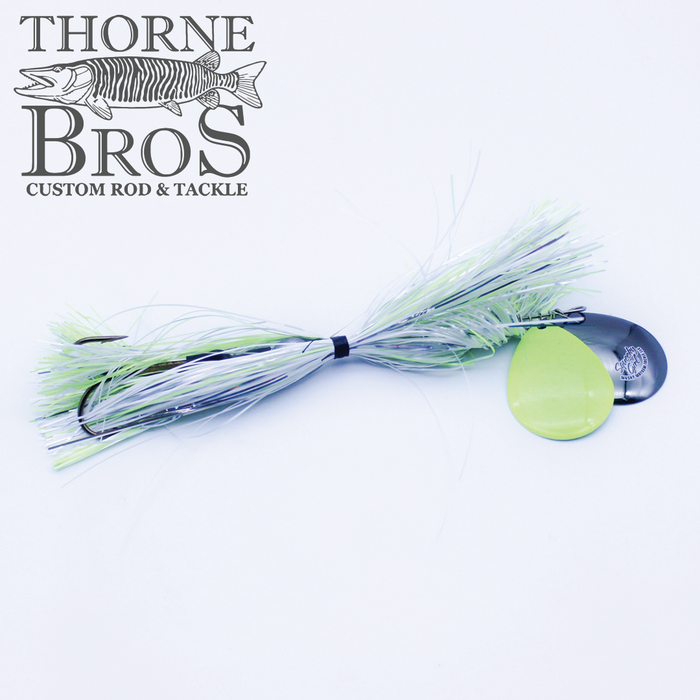 Musky Mayhem Squeeky Girl fishing lure with light green and white skirt, two attached spinner blades, designed for musky fishing and available at Thorne Bros custom rod and tackle shop.