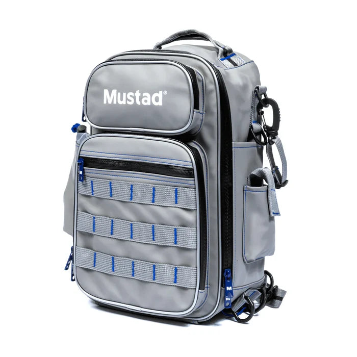 Gray Mustad Game Time Sling Pack with multiple zipped compartments, external webbing, side pouch, and padded shoulder strap designed for organized fishing tackle storage.