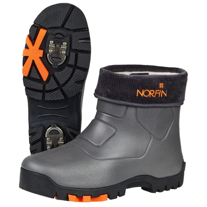 Pair of gray Norfin Klondike 2 Shoe Boots with black and orange accents, featuring durable soles with metal cleats and a black cuff with orange Norfin logo.