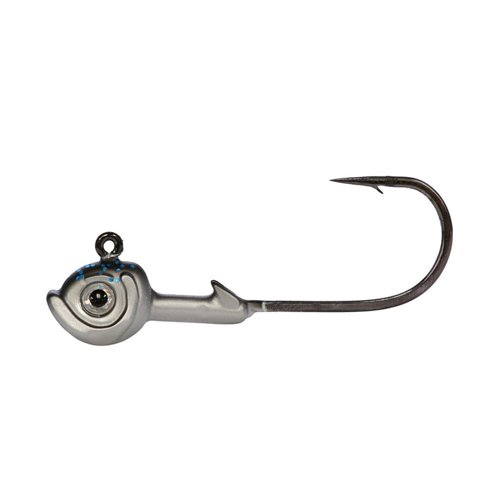 Northland Tungsten Smeltinator Jig featuring a detailed fish-head design with realistic eye, metallic finish, and a sharp single hook for fishing tackle use.