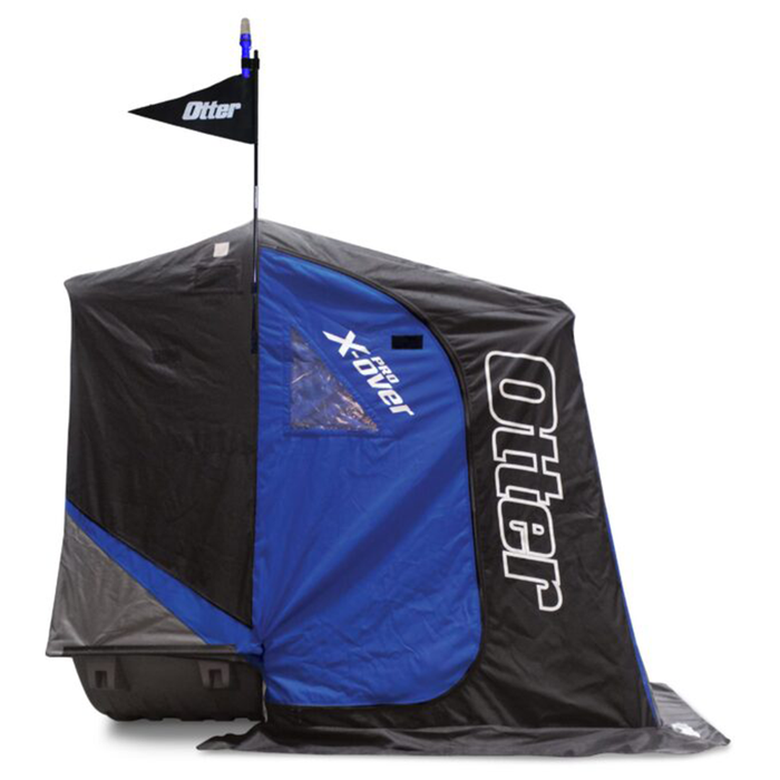Otter Beacon Light & Flag Kit attached to a black and blue ice fishing shelter with Otter branding, featuring a tall flagpole with a black flag and a light for visibility on ice.