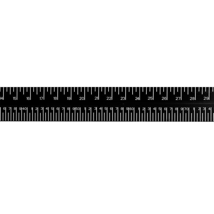 Close-up of the measurement scale on the Otter Bump Board featuring clear white numbering and markings on a black background for easy fish length tracking.