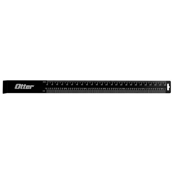 Black Otter Bump Board designed for measuring fish length, featuring clear white inch and centimeter markings and a hang hole for easy storage.