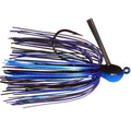 Outkast Tackle Juice Jig in black and blue, featuring a weighted head, sharp hook, and multi-strand skirt designed for lifelike movement in fishing tackle.