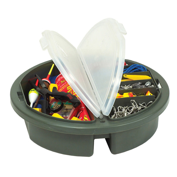 Plano Bucket Topper - 725-001 featuring a round, olive green fishing tackle organizer with two clear hinged lids revealing compartments filled with fishing lures, hooks, floats, and other fishing accessories.
