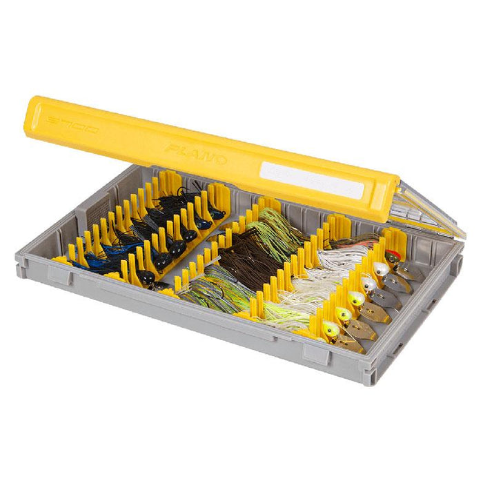 Plano EDGE Jig Box open displaying organized fishing lures in a durable gray and yellow plastic case designed for efficient fishing tackle storage and management.