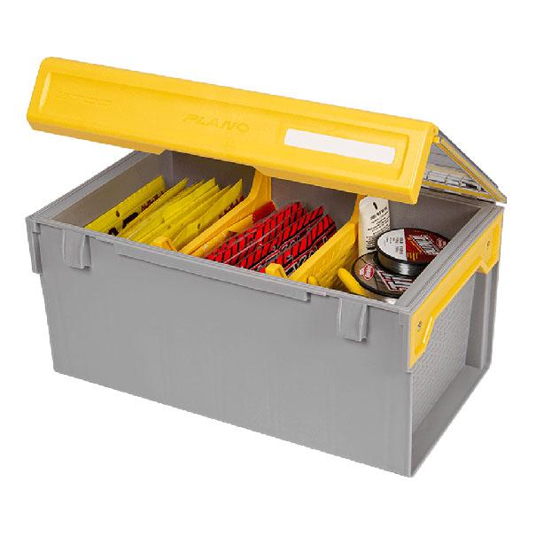 Plano EDGE Plastics Box with a yellow lid open to reveal organized compartments containing fishing tackle such as lures and spools of line inside a gray plastic storage box.