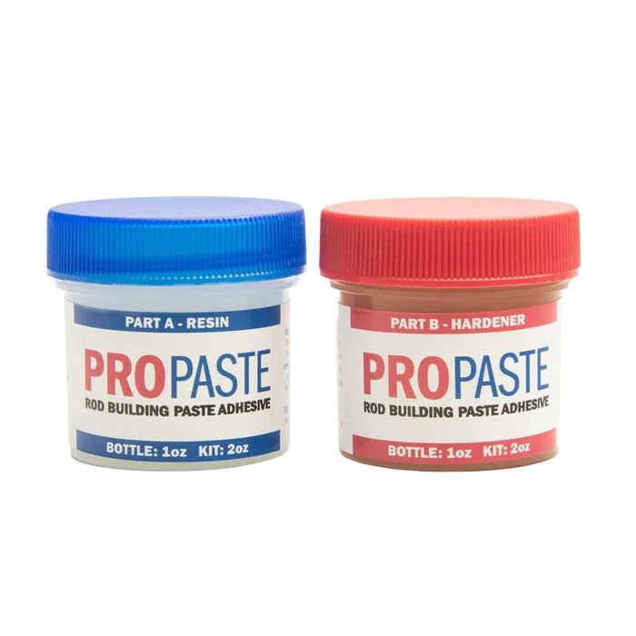 Two small plastic containers of ProPaste Paste Epoxy with blue and red screw-on lids labeled as resin and hardener for rod building paste adhesive.