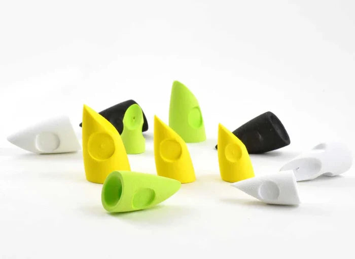 Various colored Rainy's Bisharat's Pole Dancer Foam Head fishing lure components in white, black, yellow, and green displayed on a white background, designed for musky fishing tackle.