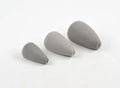 Three gray foam fishing lure components of varying sizes with tapered shapes and small holes at one end, identified as Rainy's Mouse Bodies for musky tackle and fishing gear.