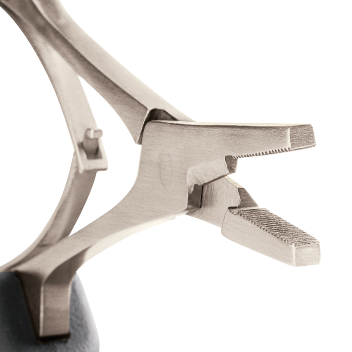 Close-up view of the metal jaws and textured gripping surfaces of the Rapala 7" Precision Forceps, designed for precise handling in fishing tackle and lure adjustments.