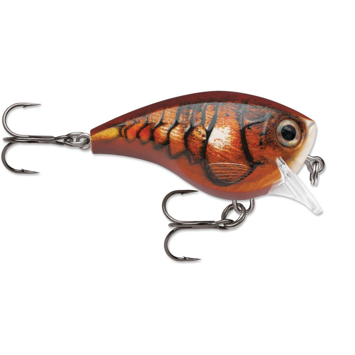 Rapala BX Brat fishing lure designed with realistic fish scale patterns in brown and orange tones, featuring two treble hooks and a clear plastic lip for diving action.