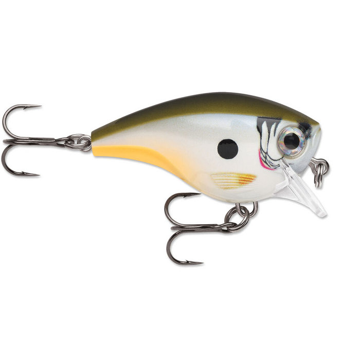 Rapala BX Brat fishing lure with a compact body in olive green, yellow, and white shades, featuring realistic fish scale patterns and two sharp treble hooks.