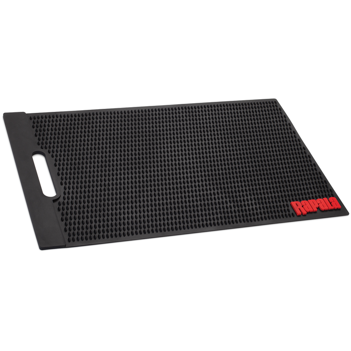 Rapala Fillet Mat is a durable black rubber mat with raised textured surface and built-in handle, designed to provide a stable, non-slip workspace for fishing tackle and filleting tasks.