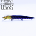 Rapala Husky Jerk - Custom Painted Colors fishing lure with a slender, elongated body in yellow and purple shades, equipped with multiple treble hooks for effective fishing tackle use.