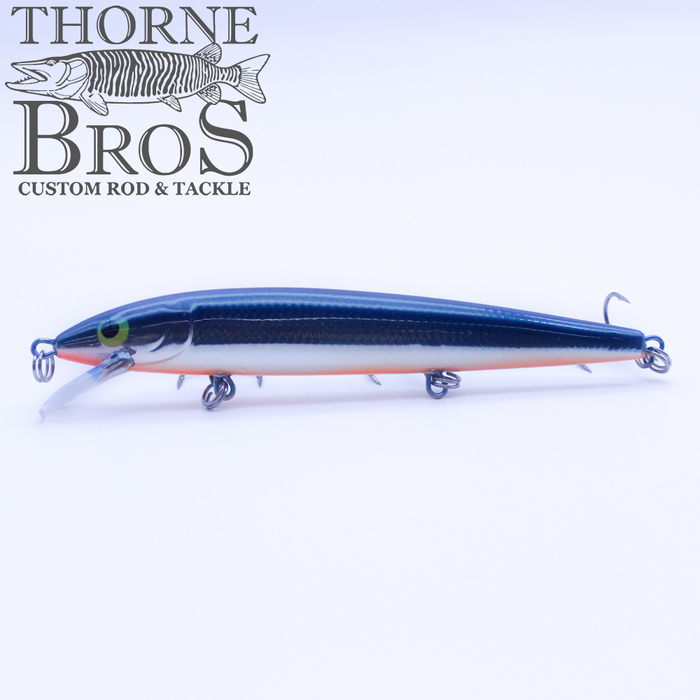 Rapala Husky Jerk - Custom Painted Colors fishing lure in black and white with green eye, featuring three treble hooks and a lip for diving, designed for musky fishing.