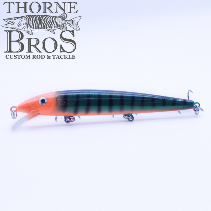 Rapala Husky Jerk - Custom Painted Colors fishing lure with green and orange body, detailed markings, and three treble hooks for effective musky and freshwater fishing.