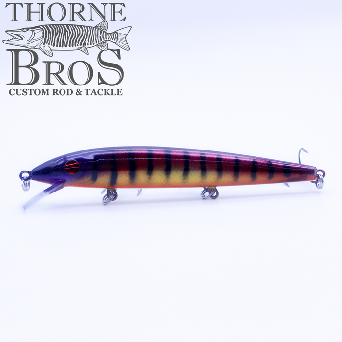 Rapala Husky Jerk - Custom Painted Colors fishing lure featuring a sleek, elongated design with a realistic striped pattern in purple, yellow, and orange for effective fishing tackle use.
