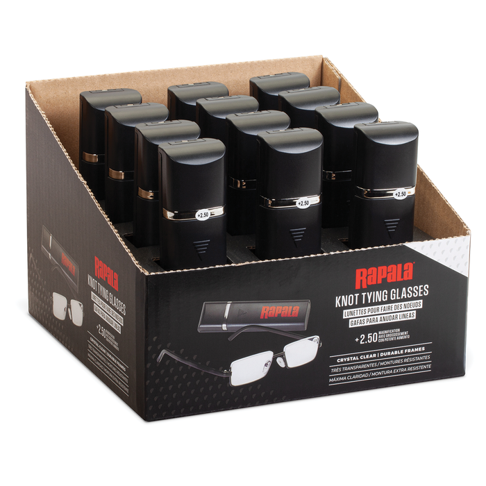 Black compact cases containing Rapala Knot Tying Glasses with +2.50 magnification, displayed in a retail box featuring images and product details for fishing tackle use.