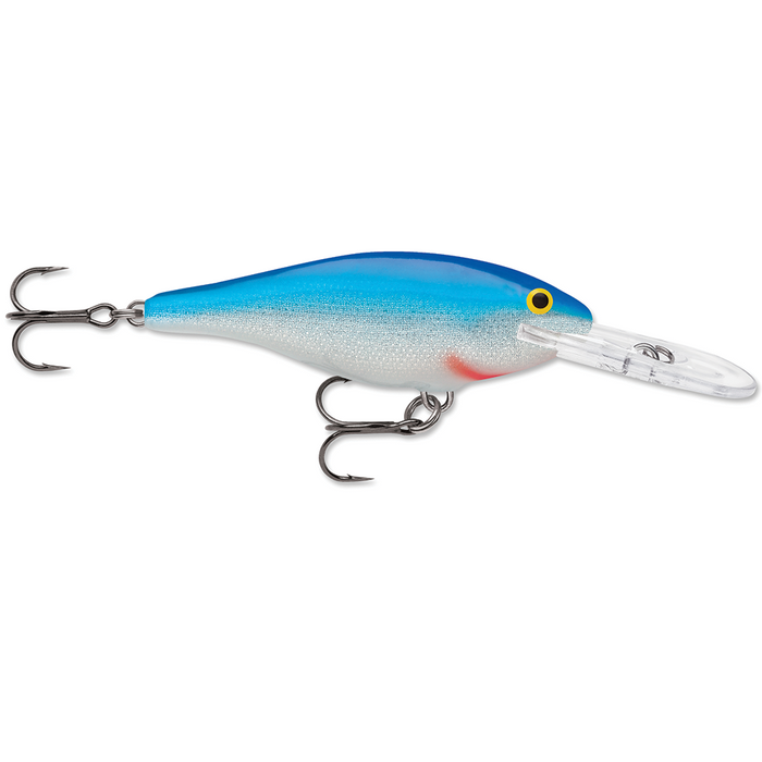 Rapala Shad Rap fishing lure in blue and silver with detailed scale pattern, yellow eye, and clear diving lip, featuring two sharp treble hooks for freshwater fishing tackle use.