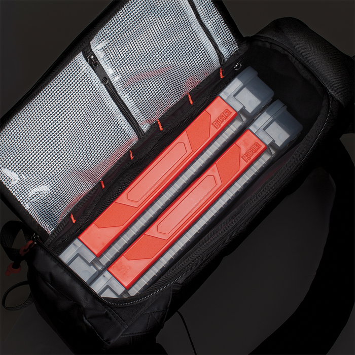 Rapala Venture 13" Backpack open to show spacious interior with two orange and gray tackle boxes and a mesh zipper pocket, designed for organized fishing tackle storage.
