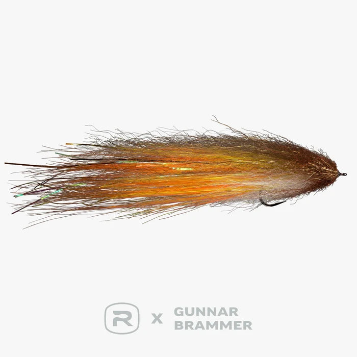 Close-up of a fishing lure featuring brown and orange fibers with subtle iridescent strands, designed as the RIO Brammer Imposter 6/0 for freshwater and warmwater fish targeting.