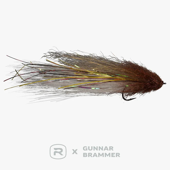 RIO Brammer Imposter 6/0 fishing lure with a densely packed brown and iridescent synthetic fibers, designed for freshwater musky fishing with detailed hook attachment.