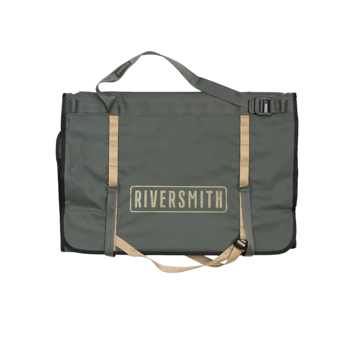 Riversmith Convoy Gear-Roll in dark green with tan straps, a durable fishing tackle bag designed for organized storage and easy transport of fishing gear.