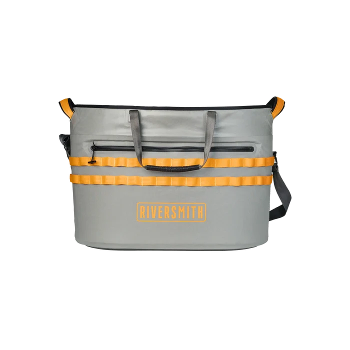 Riversmith Convoy Hauler in gray with orange accents, featuring durable handles, an external zippered pocket, and multiple attachment loops for organizing fishing tackle.