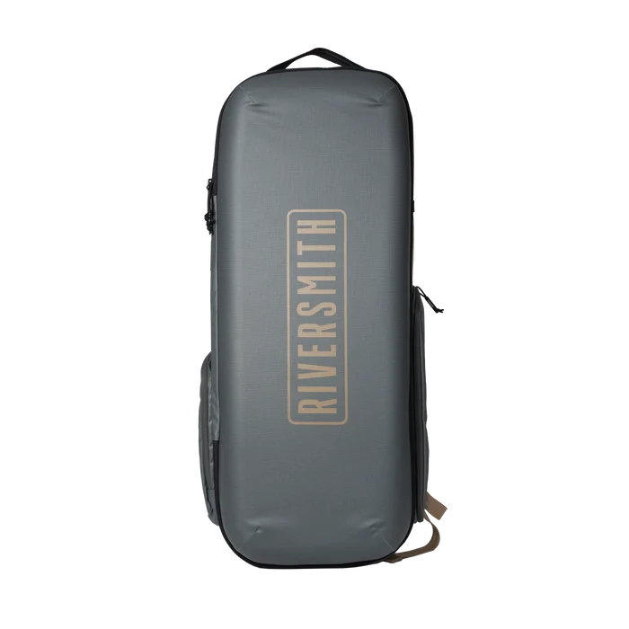 Riversmith Convoy Travel Pack in dark gray, a durable, compact travel bag designed for fishing rods and reels, featuring a vertical logo on the front.
