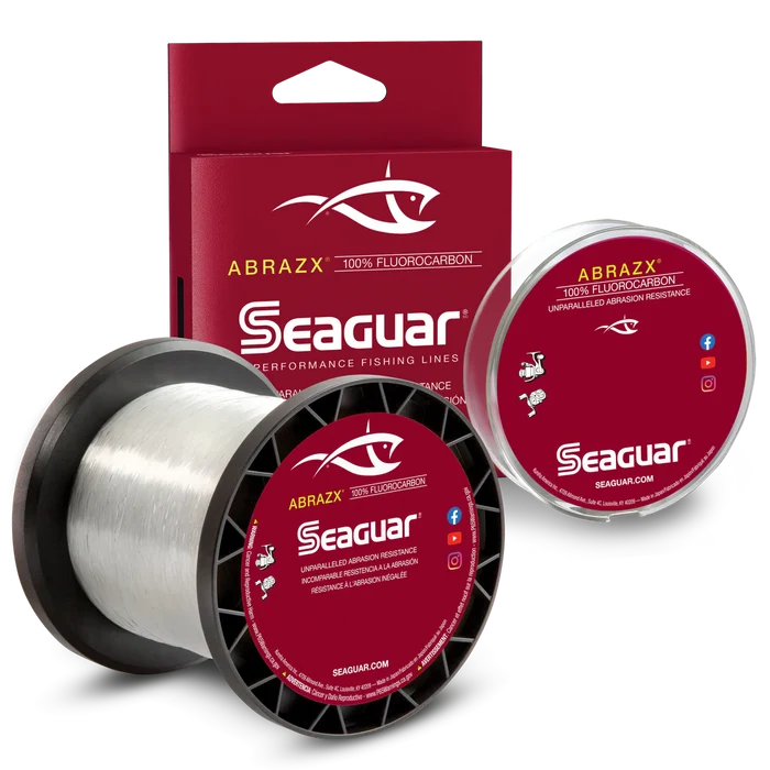 Seaguar AbrazX Fluorocarbon fishing line spool and packaging displayed, designed for high-performance fishing with abrasion resistance and clear, durable material.