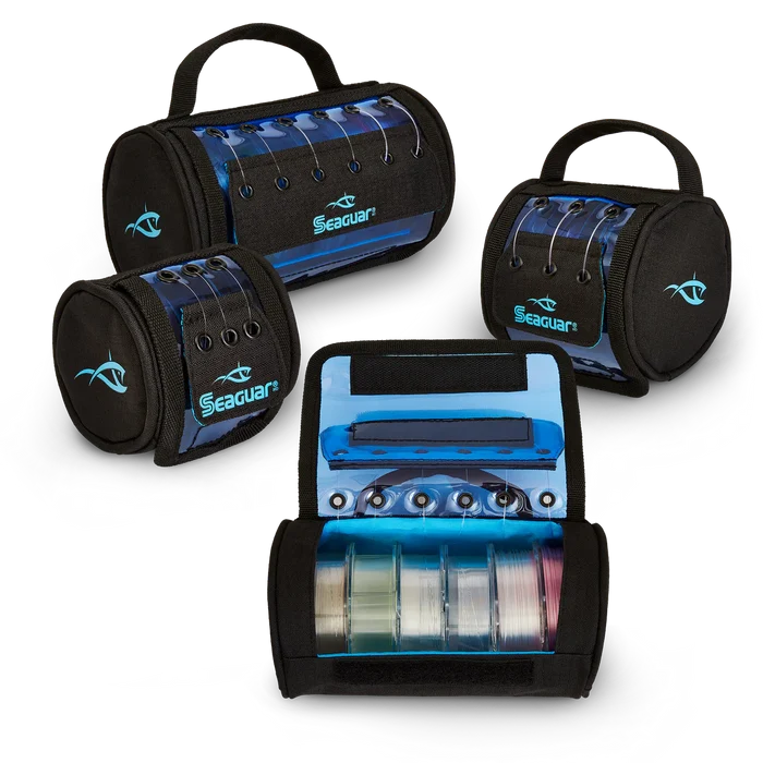 Three black and blue Seaguar Leader Feeder fishing line storage cases, one open to reveal multiple spools of fishing line inside with clear protective covers and carrying handles.