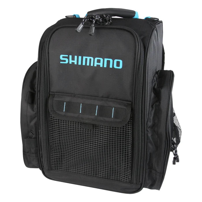 Black Shimano Blackmoon Backpacks with multiple zippered compartments, a mesh front pocket, padded top handle, and durable fabric designed for fishing tackle and gear storage.
